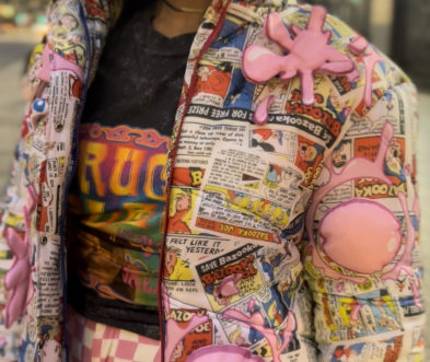 Person wearing Bazooka Joe comic-tiled puffer jacket